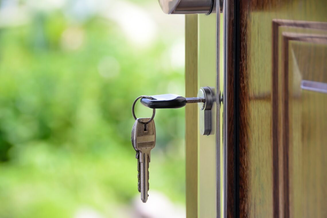 Keys inserted into the lock of a door.