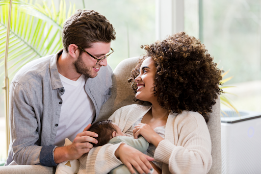 Happy new parents with baby.