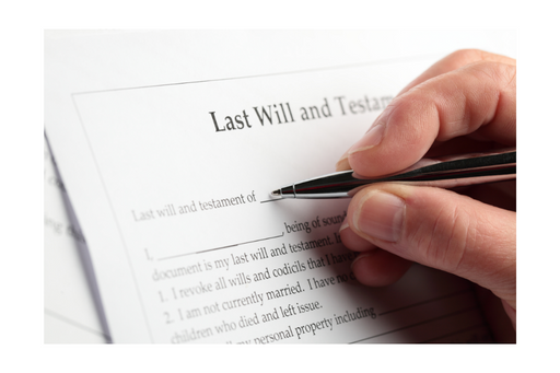 Hand signing a "Last Will and Testament" document