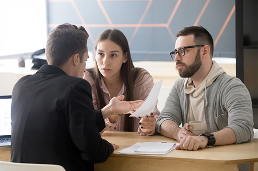 Two people arguing with a lawyer