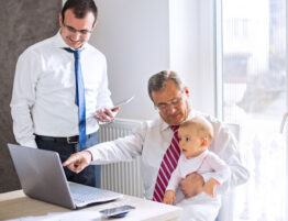 Businessman with his son and grandchild.