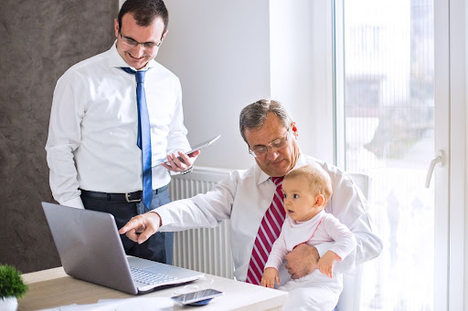 Businessman with his son and grandchild.