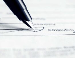 Closeup of a pen signing a will