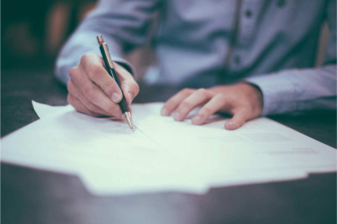 a man signing a will